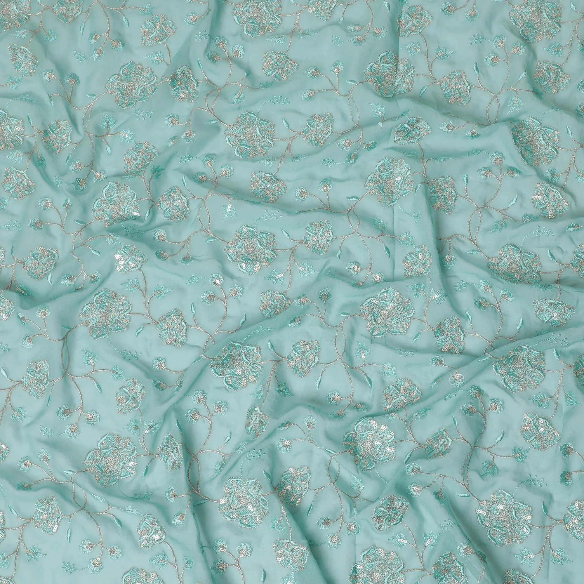 Light teal blue synthetic georgette fabric with same tone and gold embroidery in floral design-D15819